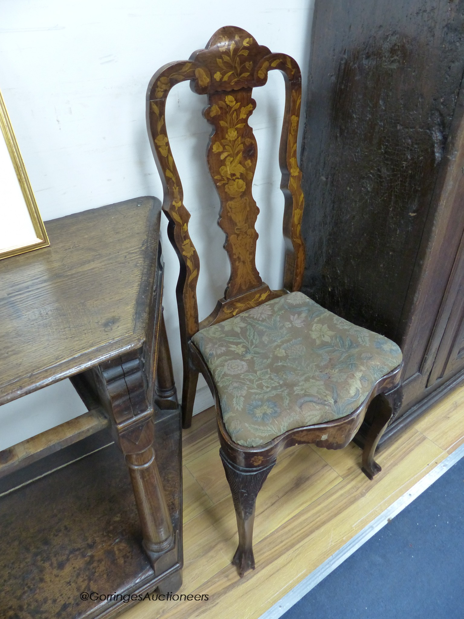 A pair of late 18th century Dutch floral marquetry walnut high back dining chairs
